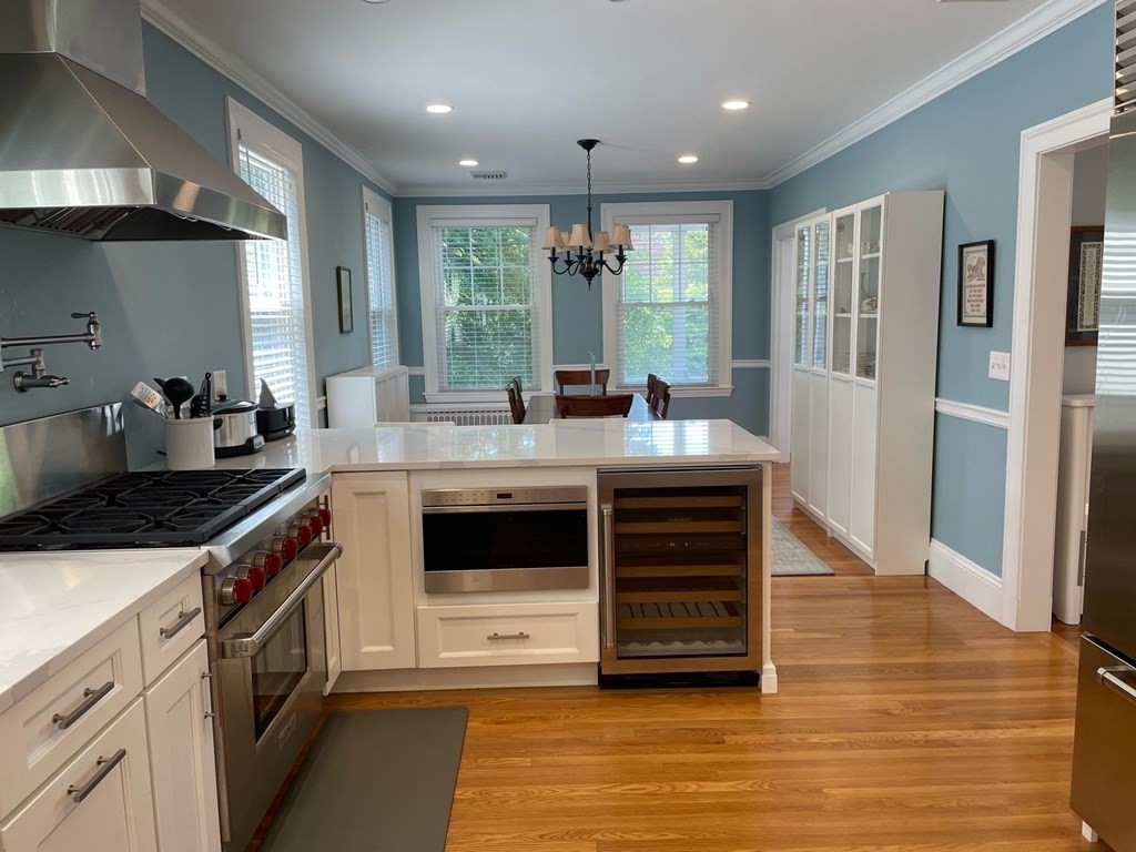 a kitchen with stainless steel appliances granite countertop a stove and a sink