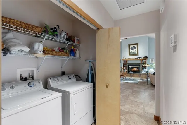 a view of storage and utility room with washer and dryer