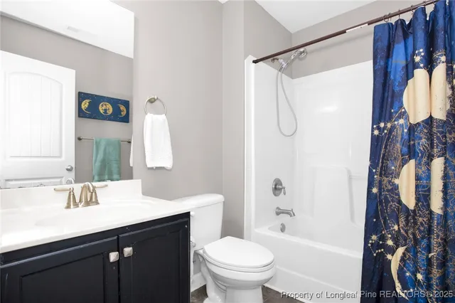 a bathroom with a sink a toilet and a bathtub