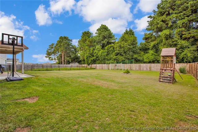 a view of yard and basketball court