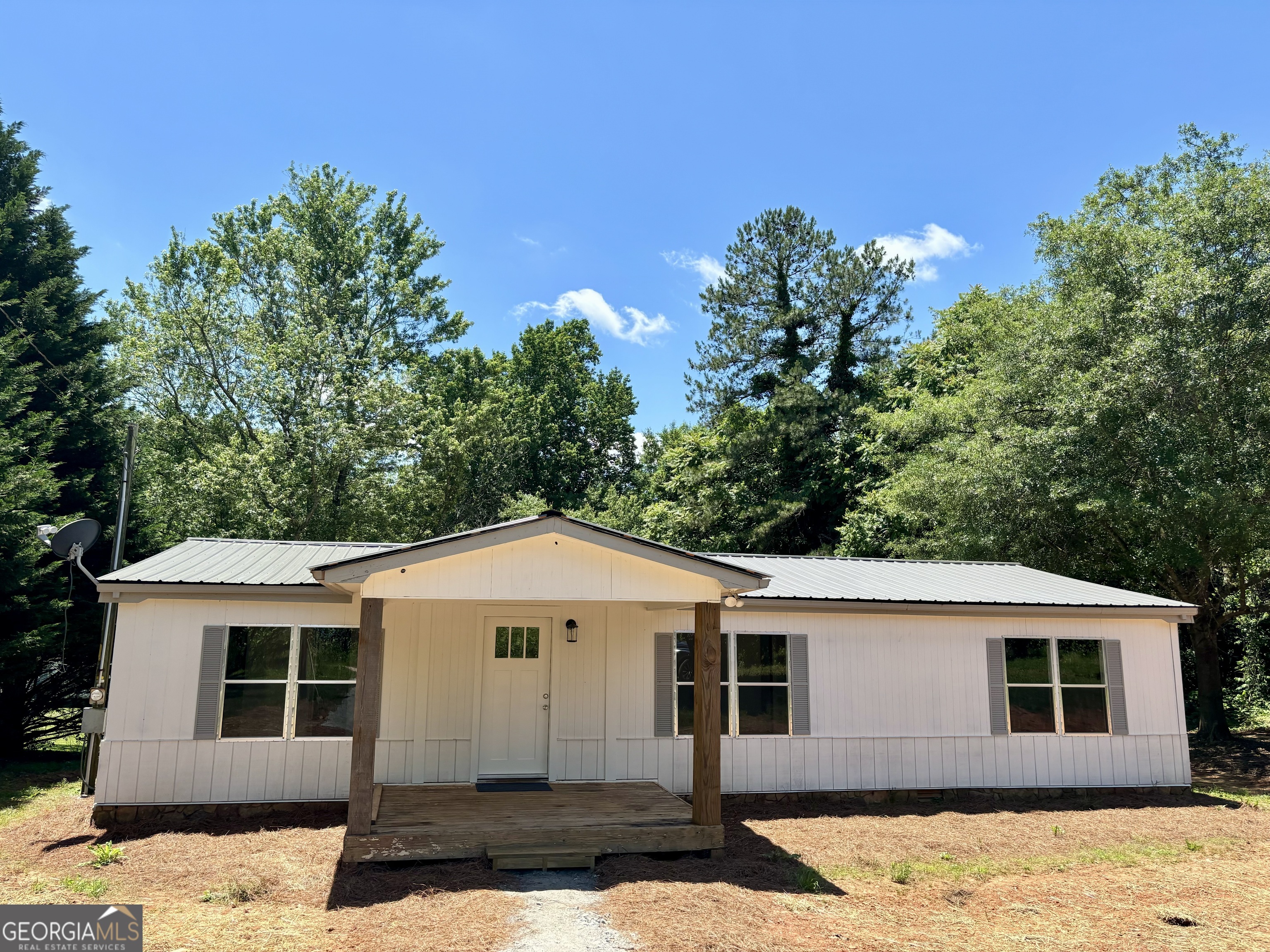 128 Dock Dorsey Road Cleveland, GA 30528 - Photo 1 of 1 a front view of a house with a yard
