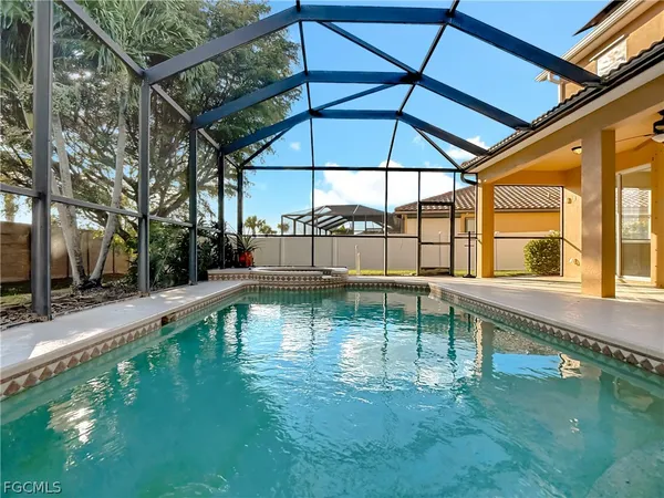 a view of a swimming pool with a patio