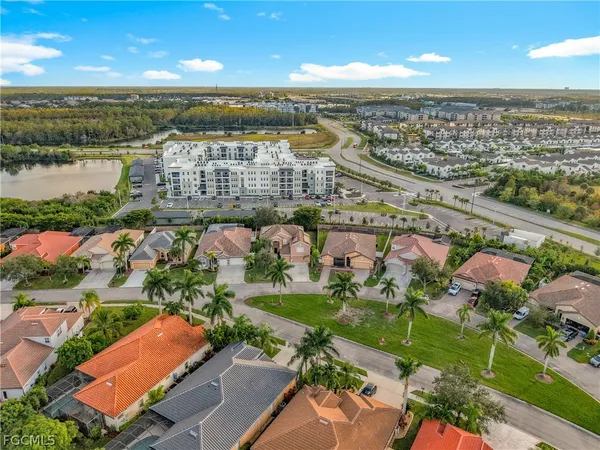 an aerial view of residential building and lake