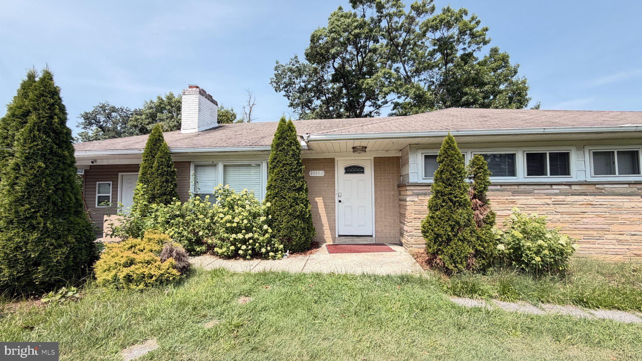 10142 Riggs Road Silver Spring, MD 20903 - Photo 1 of 1 Charming home with lush greenery.