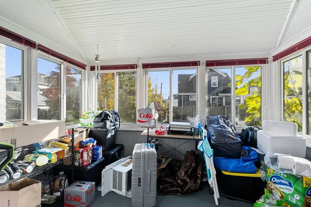 a bedroom with large bed and a window