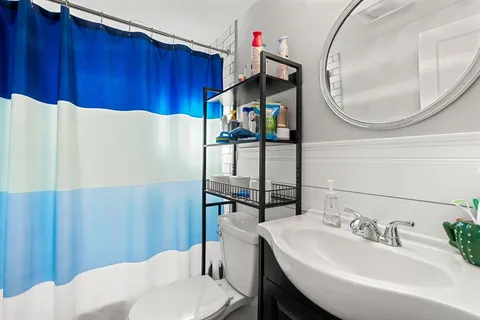 a dinning room with furniture and rug toys