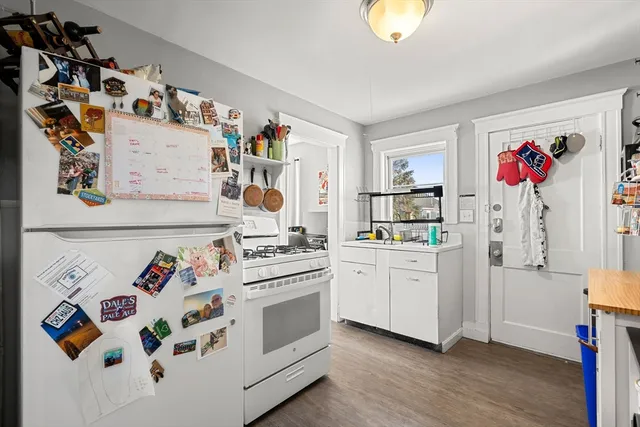 a kitchen with a stove and a refrigerator