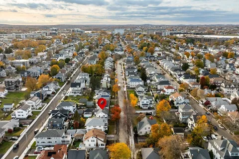 an aerial view of residential building and lake