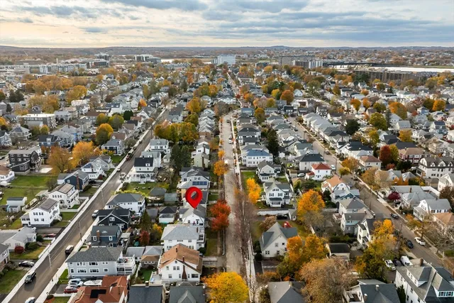 an aerial view of residential building and lake