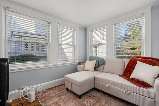 a kitchen with stainless steel appliances granite countertop a stove top oven a refrigerator a sink and dishwasher with wooden floor