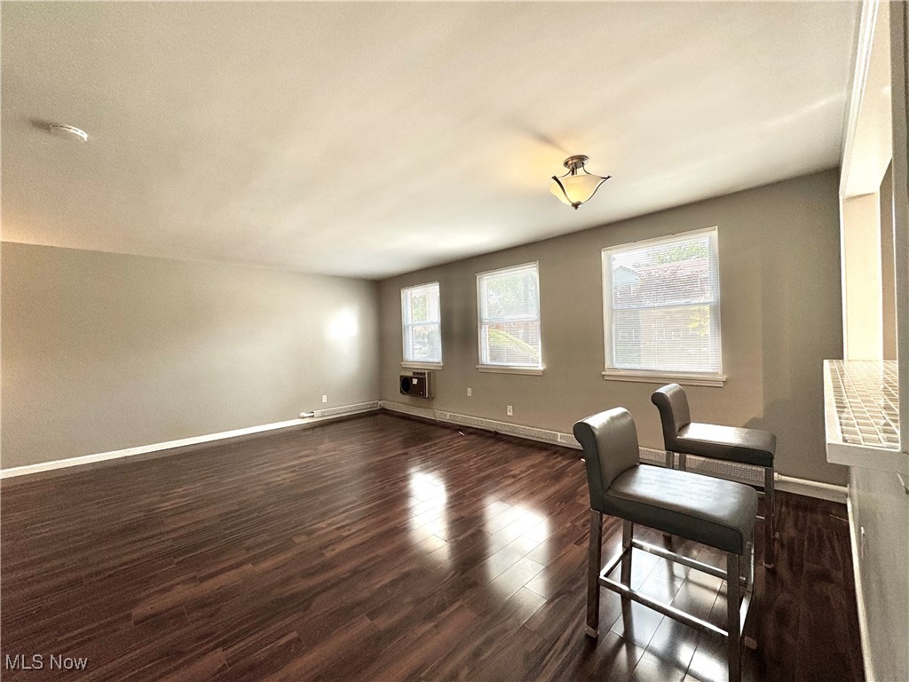 13805 Cedar Road, Unit 103C Cleveland, OH 44118 - Photo 6 of 18 Living room with dark wood-style floors