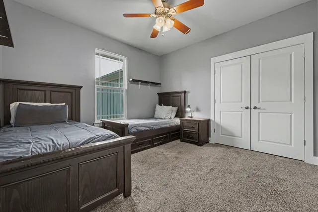 a bedroom with bed and window