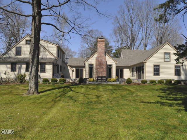26 Stuart Road West Bridgewater, CT 06752 - Photo 1 of 1 a front view of a house with a yard table and chairs