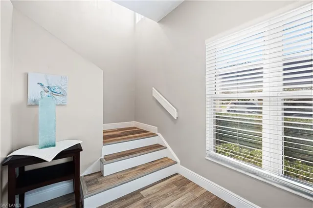 a view of wooden floor and windows in a room