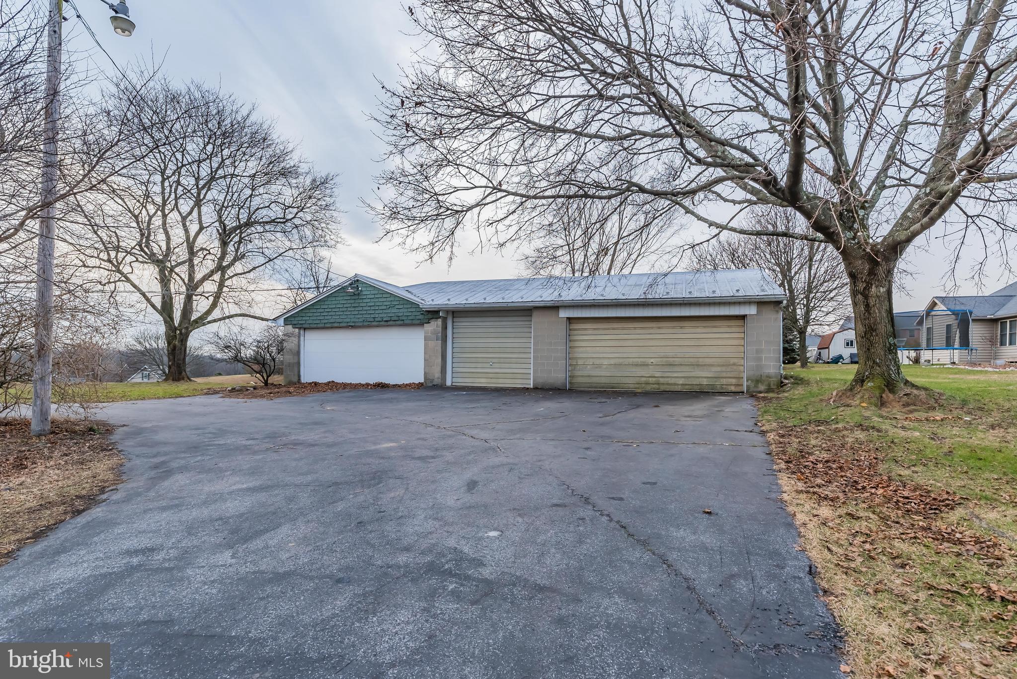 780 Longs Gap Road Carlisle, PA 17013 - Photo 9 of 31 Left bay has a wood stove for possible work shop