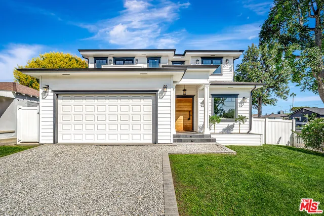 a front view of a house with a yard and porch
