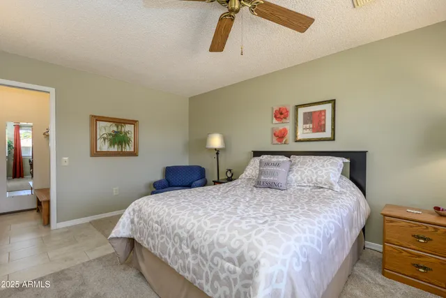 a bedroom with a bed and cupboard