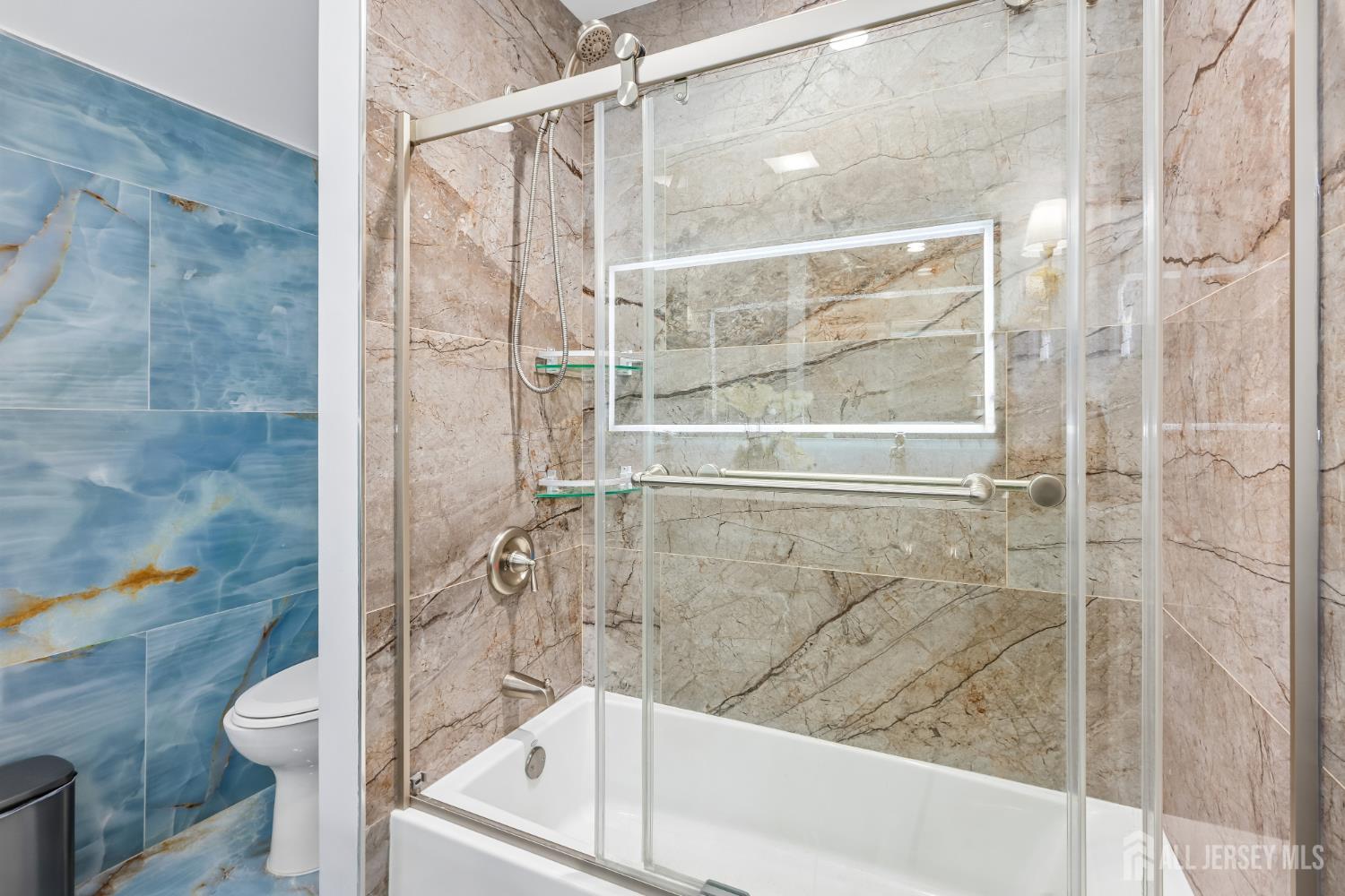 489 Plainfield Road Edison, NJ 08820 - Photo 17 of 39 a bathroom with a bathtub and a shower