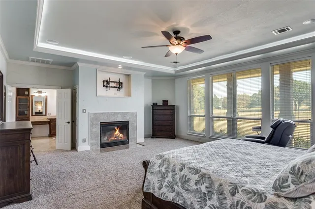 a bedroom with a bed and a fireplace