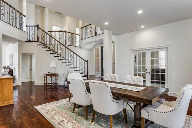a view of a livingroom with furniture a table and chairs