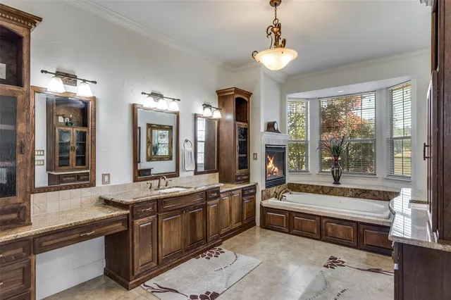 a spacious kitchen with a sink and large window
