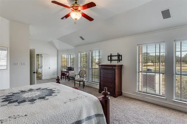 a bedroom with furniture and a window