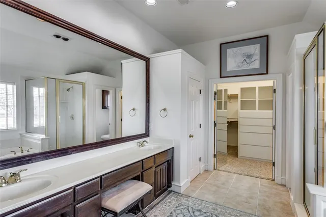 a bathroom with a sink and a large mirror