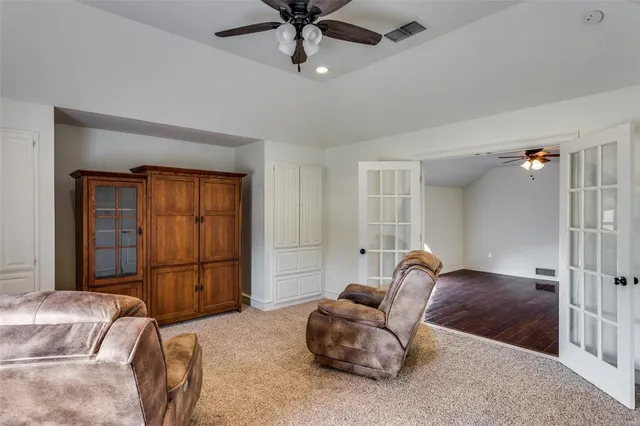 a bedroom with furniture and a window