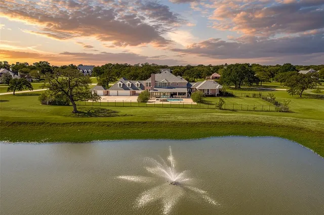a view of a golf course with a lake