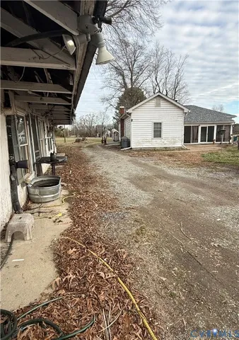 a view of a field with an trees