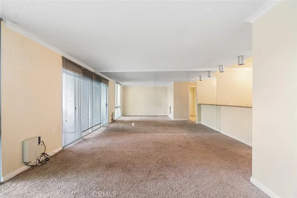 a view of empty room with windows