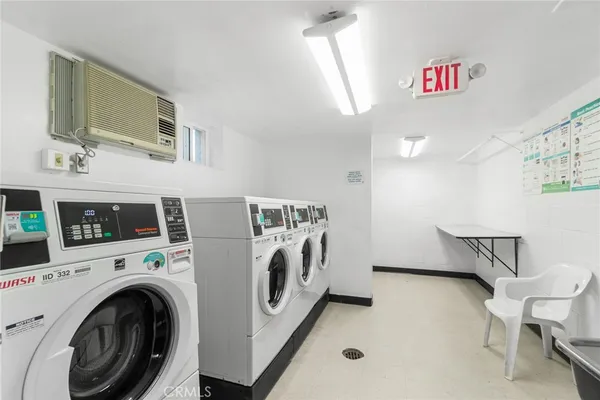 a bathroom with a sink a washer and dryer