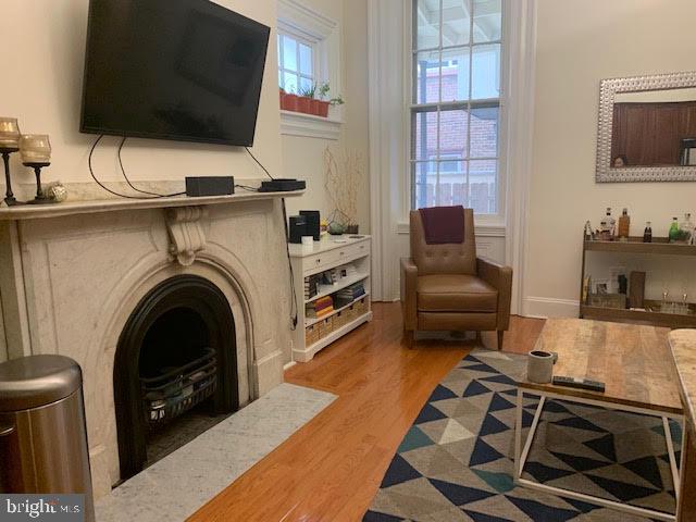 1014 Clinton Street, Unit 1R Philadelphia, PA 19107 - Photo 6 of 14 a living room with furniture and a flat screen tv