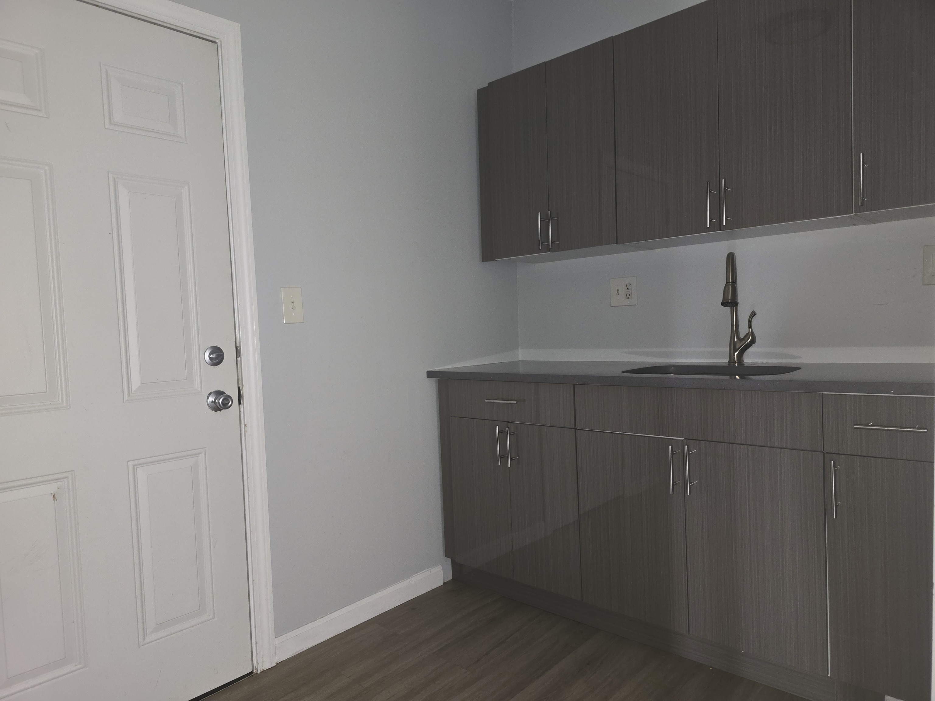 a view of cabinets and wooden floor