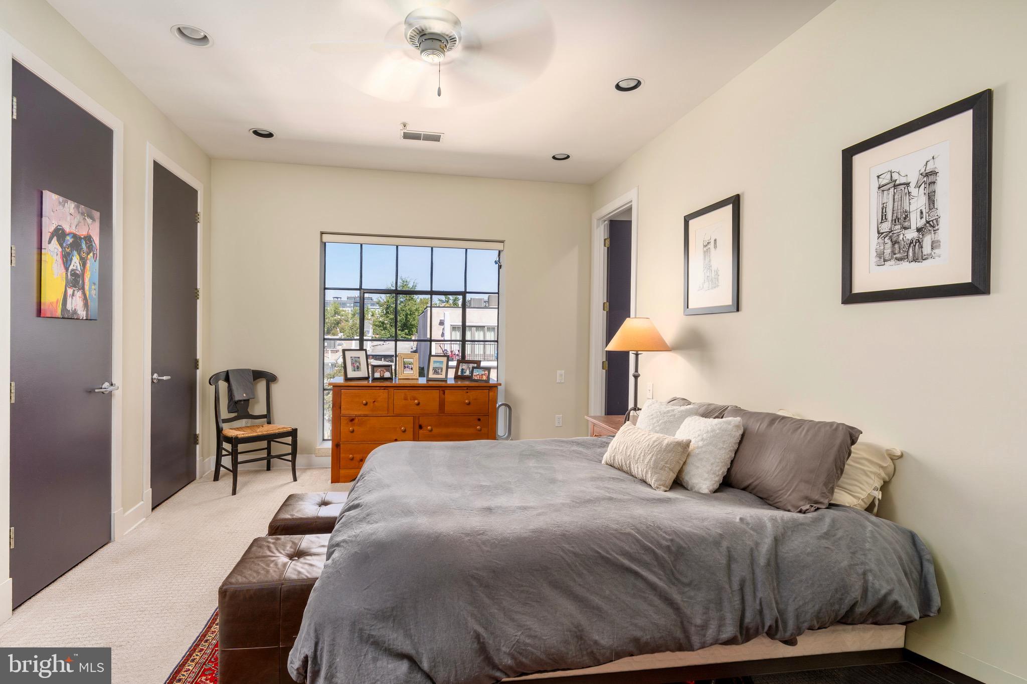 1741 Johnson Avenue Northwest, Unit 301 Washington, DC 20009 - Photo 15 of 31 a bedroom with a bed and wooden floor