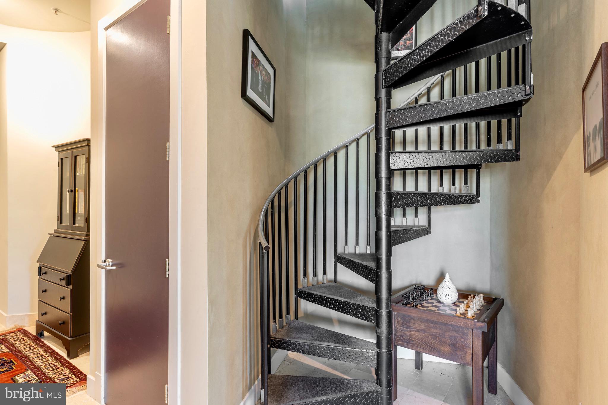1741 Johnson Avenue Northwest, Unit 301 Washington, DC 20009 - Photo 21 of 31 a view of staircase with white walls and a window