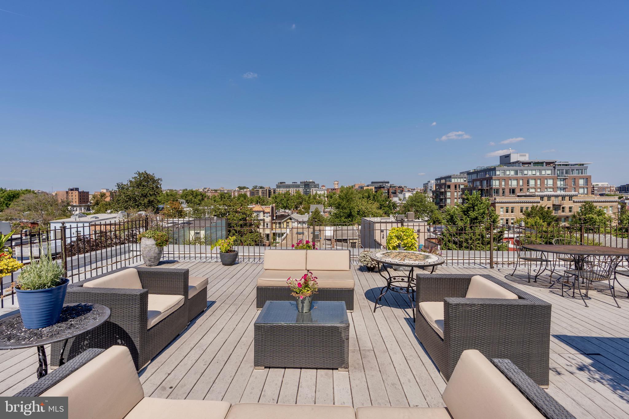 1741 Johnson Avenue Northwest, Unit 301 Washington, DC 20009 - Photo 23 of 31 a view of a roof deck with couches and potted plants