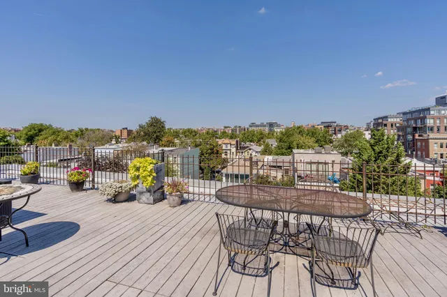 a view of roof deck with seating space