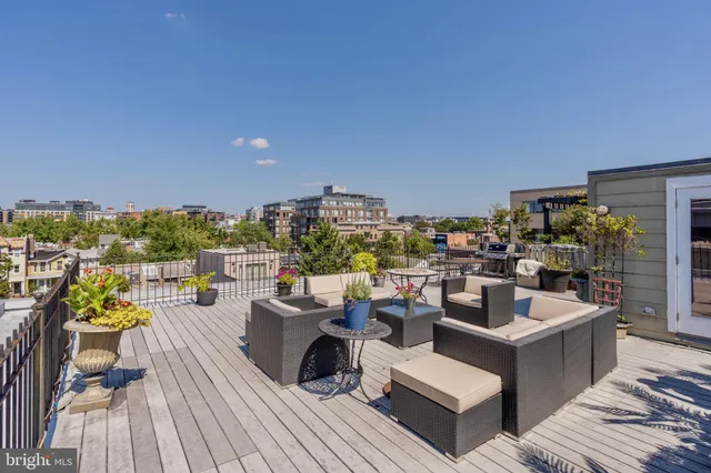 a view of a roof deck with couches