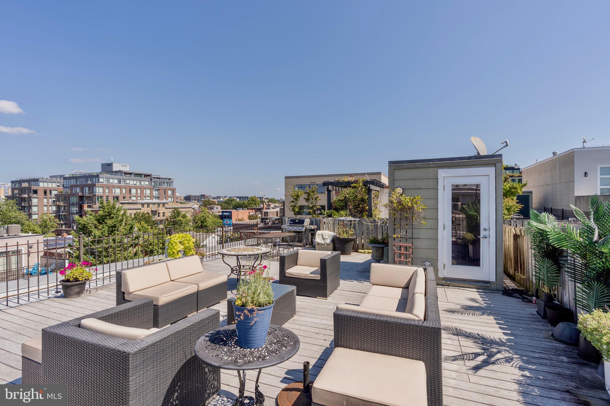 1741 Johnson Avenue Northwest, Unit 301 Washington, DC 20009 - Photo 27 of 31 a living room with furniture and a floor to ceiling window