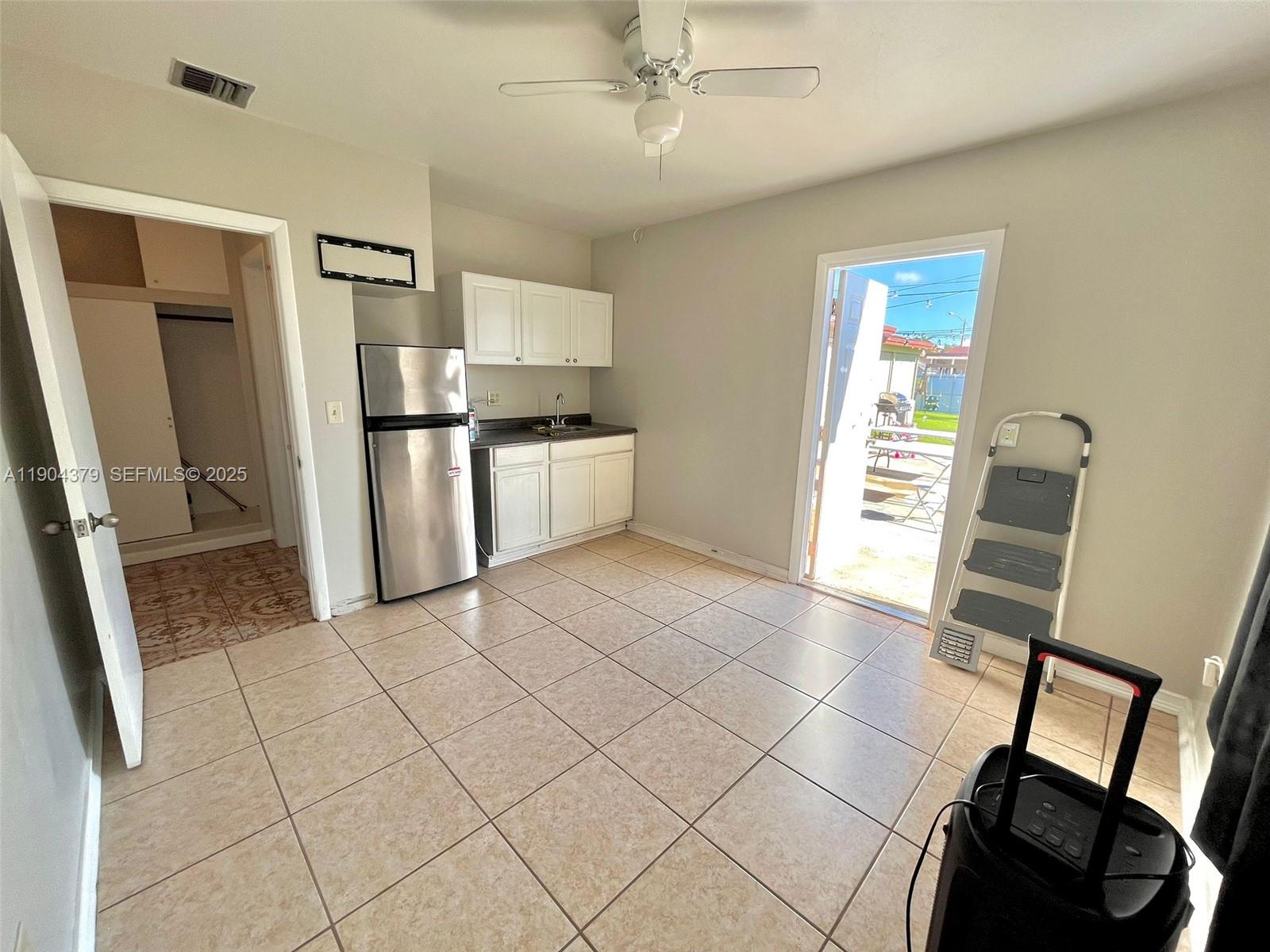 1541 Northeast 13th Street Homestead, FL 33033 - Photo 2 of 4 a kitchen with stainless steel appliances a refrigerator sink and microwave