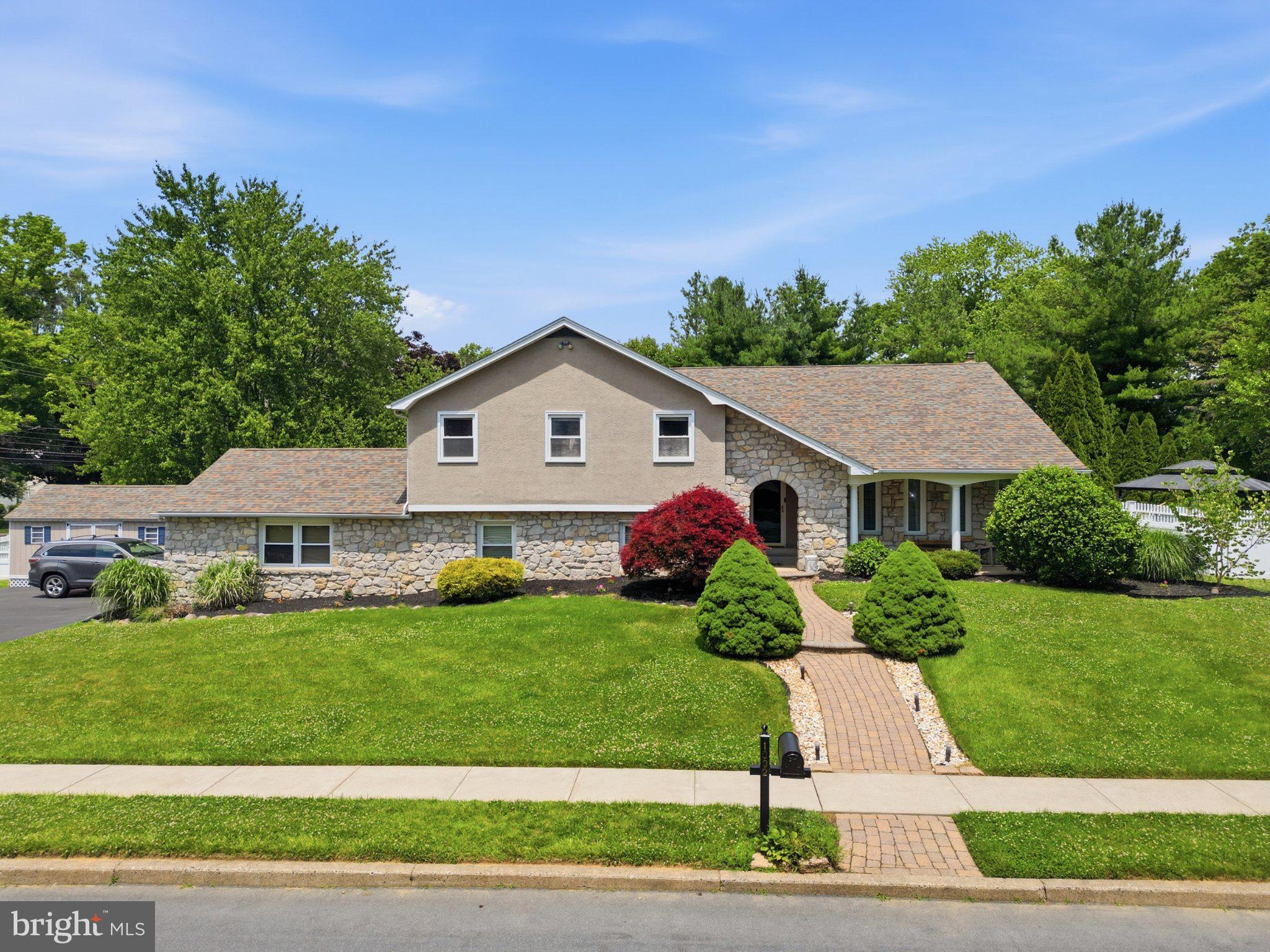 1002 Tannerie Run Road Ambler, PA 19002 - Photo 1 of 67 Charming home with lush greenery.