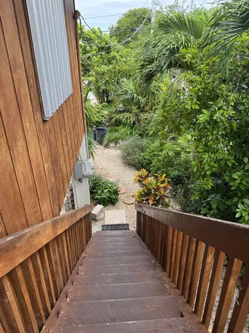 a view of a balcony with wooden floor