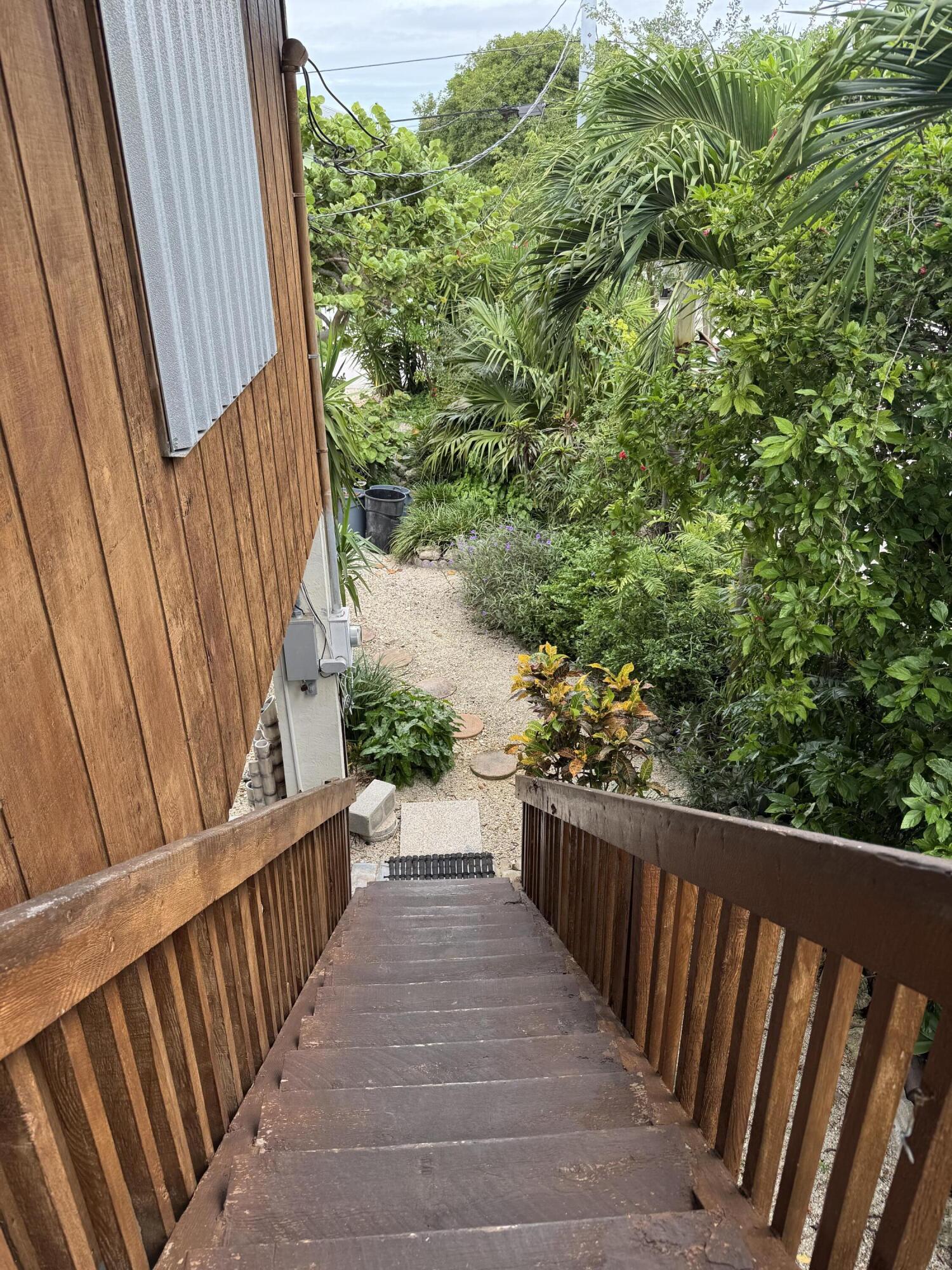 22970 Sharp Lane Cudjoe, FL 33042 - Photo 27 of 45 a view of a balcony with wooden floor