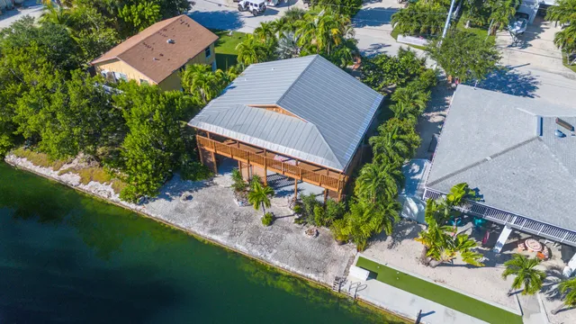 an aerial view of house with yard