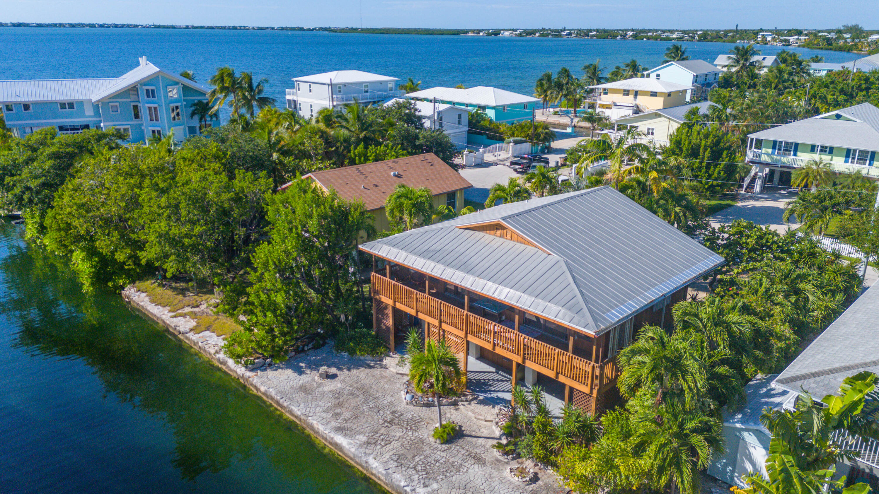 22970 Sharp Lane Cudjoe, FL 33042 - Photo 31 of 45 an aerial view of a house with a garden and plants