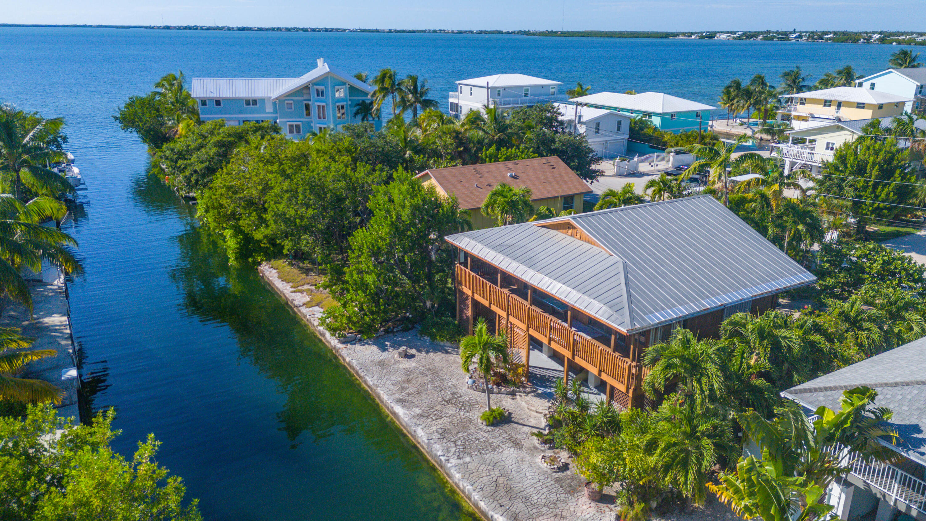 22970 Sharp Lane Cudjoe, FL 33042 - Photo 32 of 45 an aerial view of a house with a yard and garden