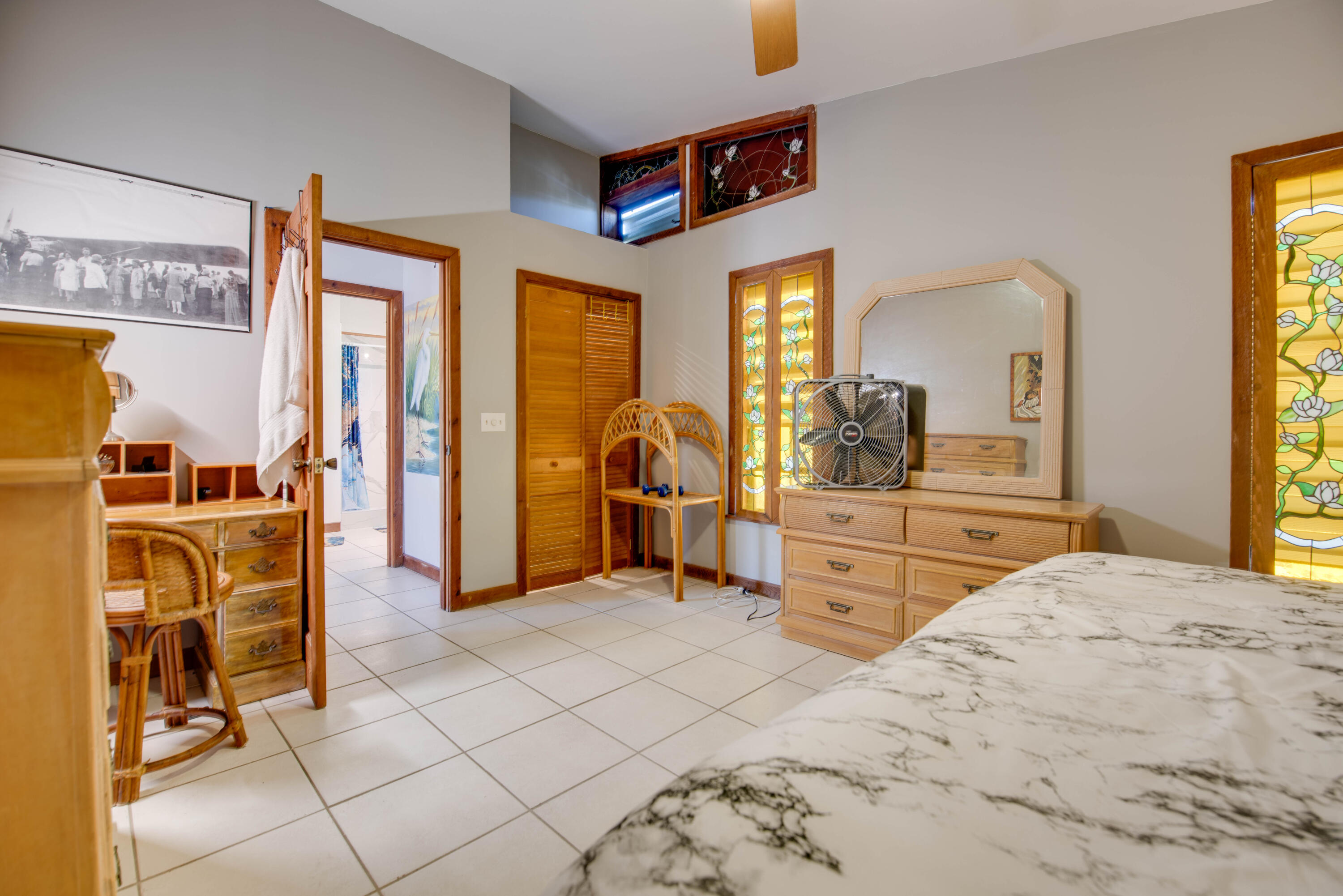 22970 Sharp Lane Cudjoe, FL 33042 - Photo 44 of 45 a bedroom with a bed and wooden floor