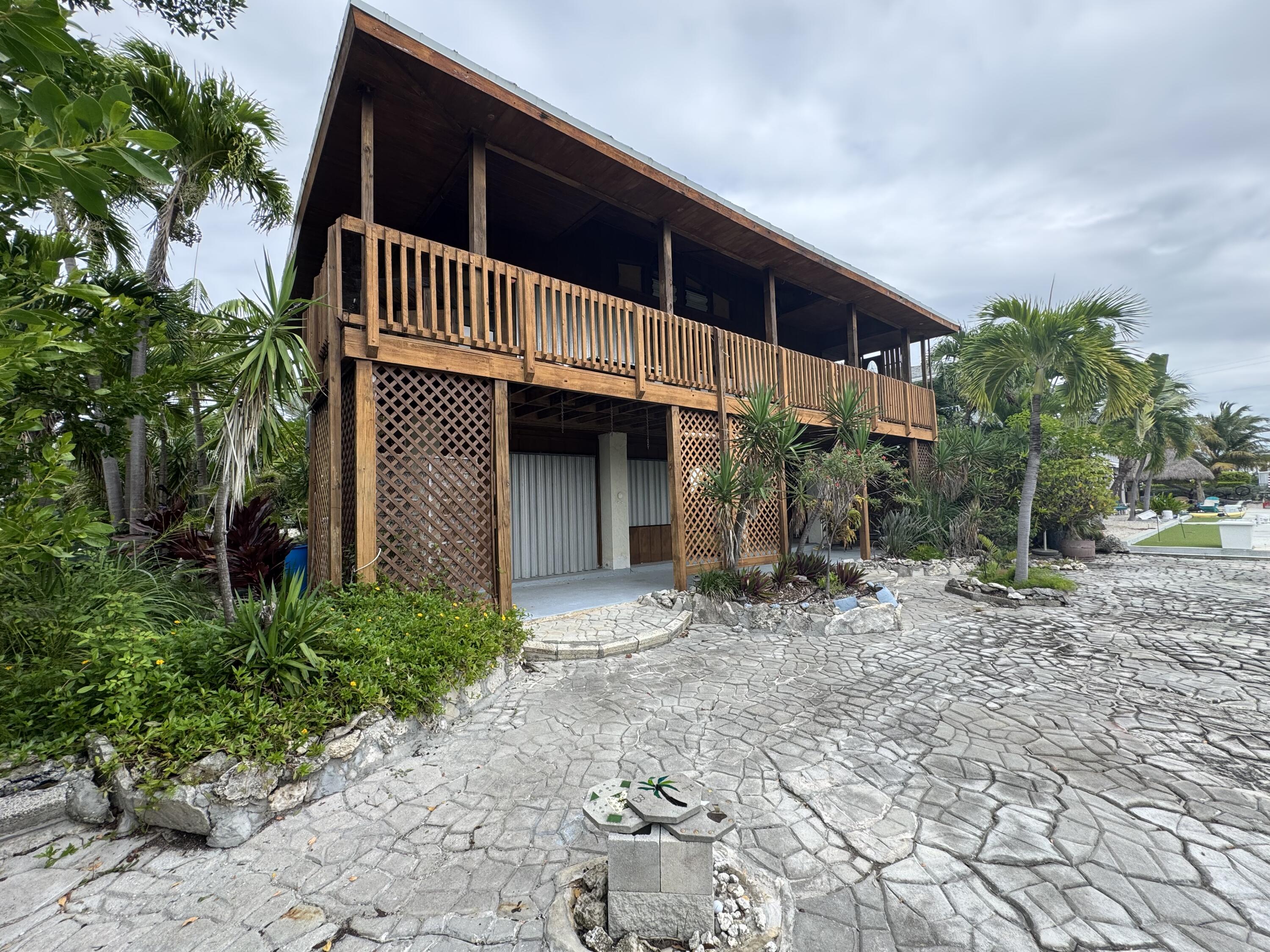 22970 Sharp Lane Cudjoe, FL 33042 - Photo 5 of 45 a view of a house with a yard