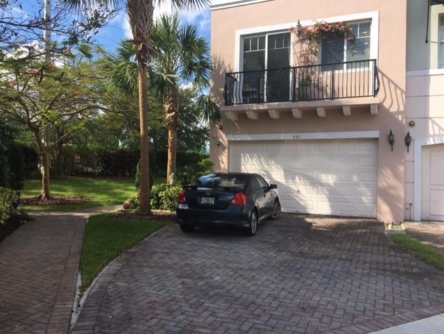 555 Northwest 35th Place Boca Raton, FL 33431 - Photo 1 of 43 a view of a car parked in front of a house